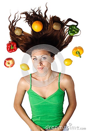 Beautiful woman lying with fruits and hair Stock Photo