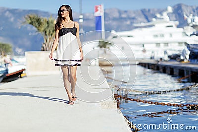 Beautiful woman in marina posing Stock Photo