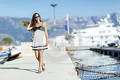 Beautiful woman in marina posing Stock Photo