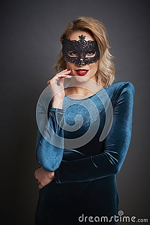 Beautiful woman with masquerade mask Stock Photo