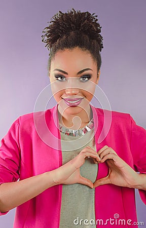 Beautiful woman mixed rase holding her hands as heart Stock Photo