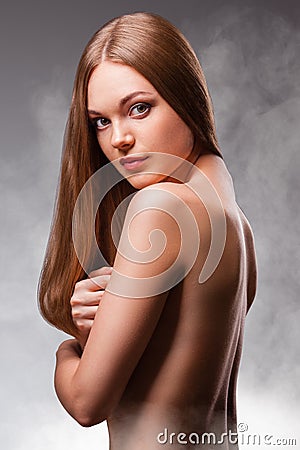 Beautiful woman with naked back portrait Stock Photo