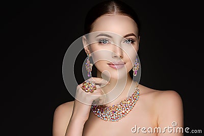 Beautiful woman in a necklace, earrings and ring. Model in jewel Stock Photo