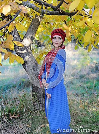 Beautiful woman outdoor portrait, dressed in knitted beret and blue cardigan Stock Photo