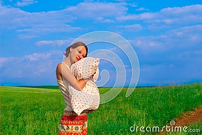 Beautiful woman with pillow in the elbowroom Stock Photo