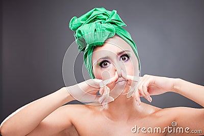 Beautiful woman pinch nose Stock Photo