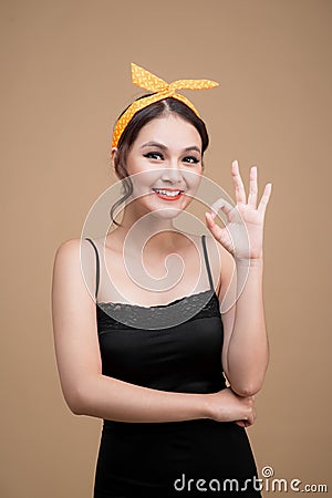 Beautiful woman pinup style portrait. Asian woman hands gesture Stock Photo