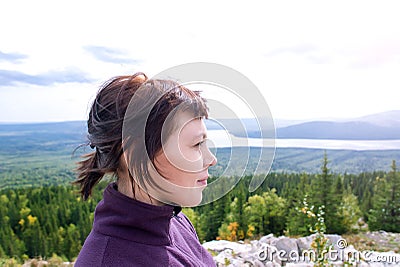 Beautiful woman pleasure wanderlust mindfulness hiking mountain sunshine Zyuratkul Chelyabinsk Russia. Stock Photo