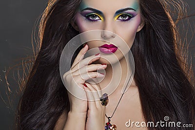 Beautiful woman portrait with bright colourful makeup Stock Photo