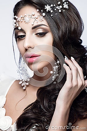 Beautiful woman portrait with nice makeup and white jewelry. Stock Photo