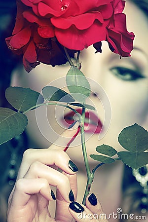 Beautiful woman portrait with rose Stock Photo