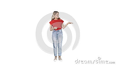 Beautiful woman presenter showing imaginary images from her left and right on white background. Stock Photo