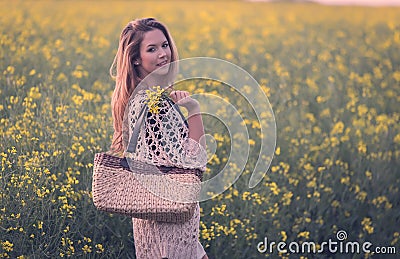 Beautiful woman in rapeseed field Stock Photo