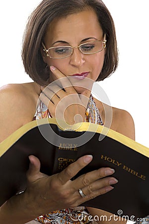 Beautiful woman reading bible Stock Photo