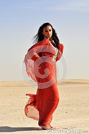 beautiful woman red dress arabic desert 16810132