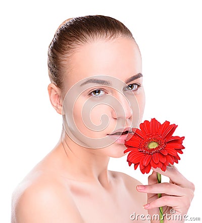 Beautiful woman with red gerbera. Isolated on Stock Photo