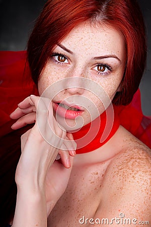 Beautiful woman with red hair and freckles Stock Photo