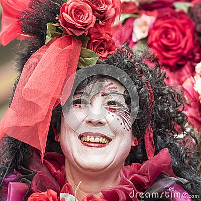Beautiful woman in red roses, carnival Zurich Editorial Stock Photo