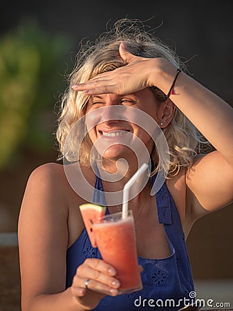 Beautiful woman relaxing on the beach restaurant Stock Photo