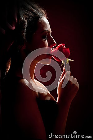 Beautiful woman with a rose Stock Photo