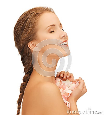 Beautiful woman with rose petals Stock Photo