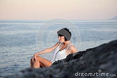 Beautiful woman by the sea Stock Photo