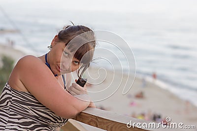 Beautiful woman seduces the sea Stock Photo