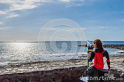 Beautiful Woman Sighting A Boat In The Infinity Through A Spyglass On The Beach Of The Americas. April 11, 2019. Santa Cruz De Editorial Stock Photo