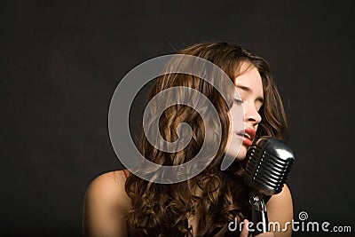 Beautiful woman singing Stock Photo