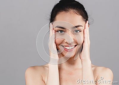 Beautiful woman skincare beauty face teeth smile with handsclo Stock Photo