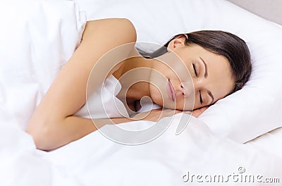 Beautiful woman sleeping in bed Stock Photo