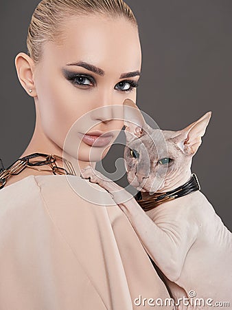 Beautiful woman with Sphynx cat Stock Photo