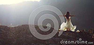 Beautiful woman spinning with arms open Stock Photo