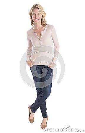 Beautiful Woman Standing Hands In Pockets Over White Background Stock Photo