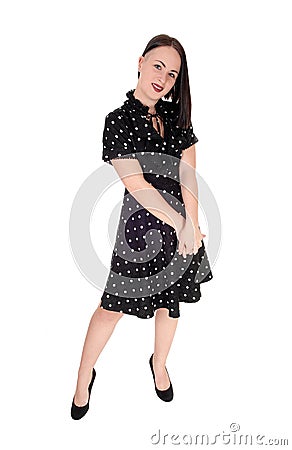 Beautiful woman standing in an pock dot dress Stock Photo