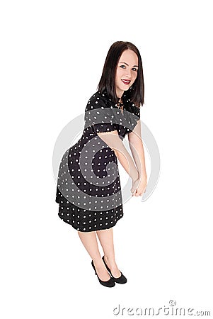 Beautiful woman standing in an pock dot dress Stock Photo