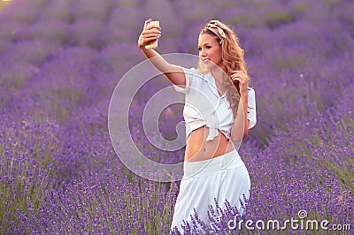 Beautiful woman take a photo in the lavender field Stock Photo