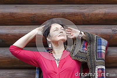 Beautiful woman threw her hands behind her head enjoying life Stock Photo