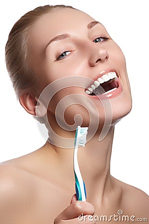 Beautiful woman with toothbrush. Dental care background. Closeup on young woman showing toothbrush. Beautiful young woman Stock Photo