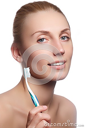 Beautiful woman with toothbrush. Dental care background. Closeup on young woman showing toothbrush. Beautiful young woman Stock Photo