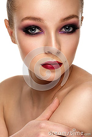 Beautiful Woman Touching her shoulder. Beauty Portrait. Bright c Stock Photo