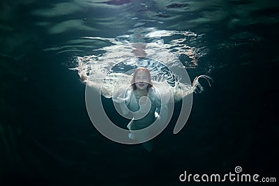 Beautiful woman under the water. Stock Photo