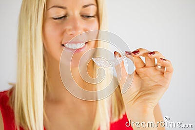 Woman using teeth whitening braces Stock Photo