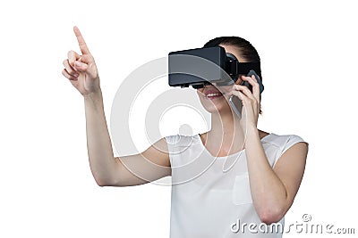 Beautiful woman using virtual reality headset and talking on mobile phone Stock Photo