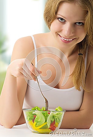 Beautiful woman with vegetable vegetarian salad Stock Photo