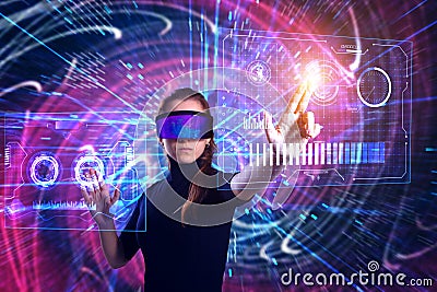 Beautiful woman in virtual reality glasses on a futuristic background. Augmented reality, game, future technology concept. VR Stock Photo