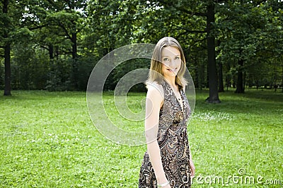 Beautiful Woman Walking On The Park Stock Photo