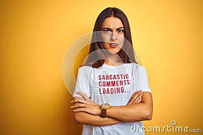 Beautiful woman wearing fanny t-shirt with irony comments over isolated yellow background skeptic and nervous, disapproving Stock Photo