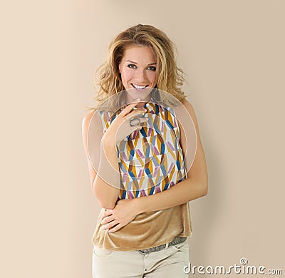 Beautiful woman wearing trendy clothes on beige background Stock Photo