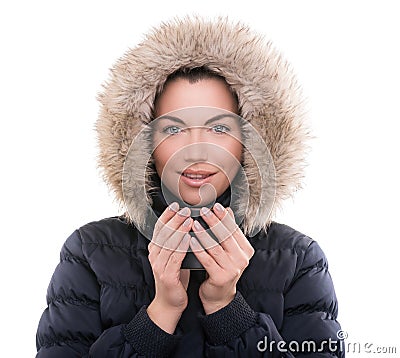 Beautiful woman with winter anorak and mug of hot tea Stock Photo